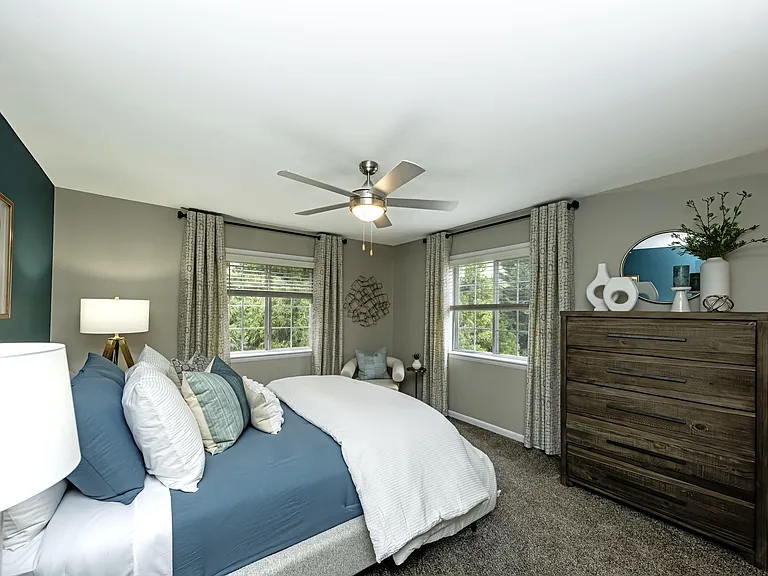 Cozy bedroom suite with ceiling fan