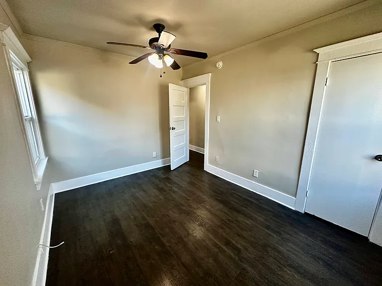Good sized bedroom with ceiling fan and closet.
