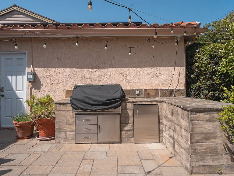 Barbecue grill and mini fridge