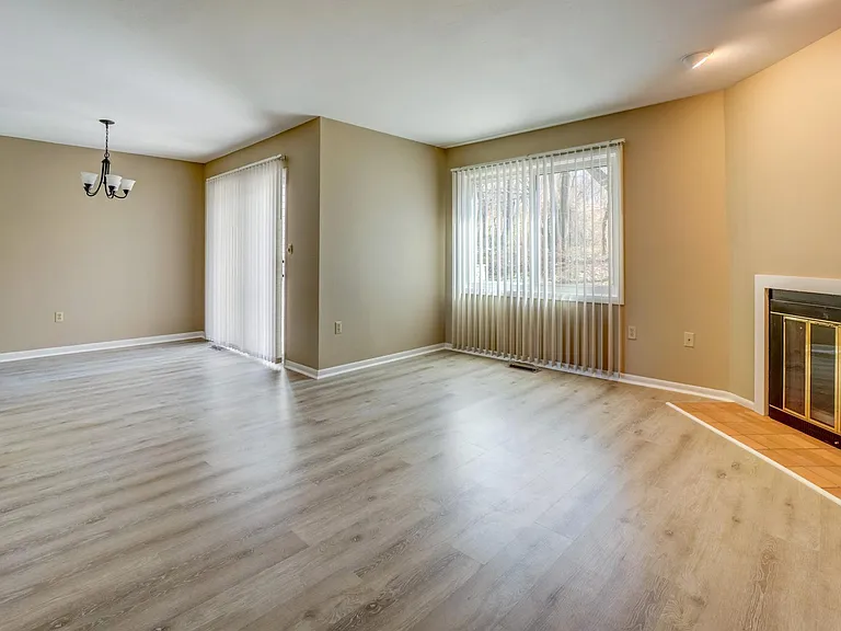 LIVING ROOM WITH FIREPLACE OPENS TO DINING AREA