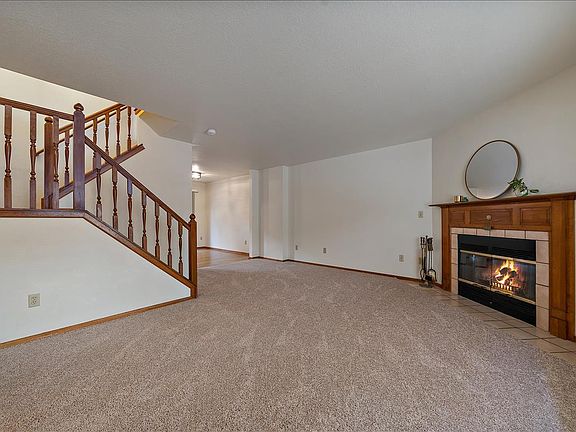 Cozy living room with a wood burning fireplace.