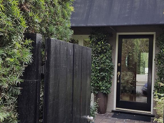 Private front door with beautiful garden.