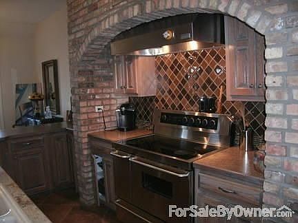 exposed brick gourmet kitchen
						:
						all stainless appliances including convection oven;large granite island