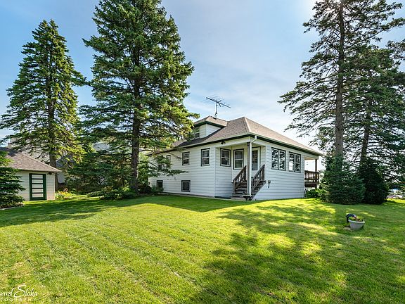 Enter this solid home street Side ~ Enter into the heated enclosed porch which opens out onto the ba