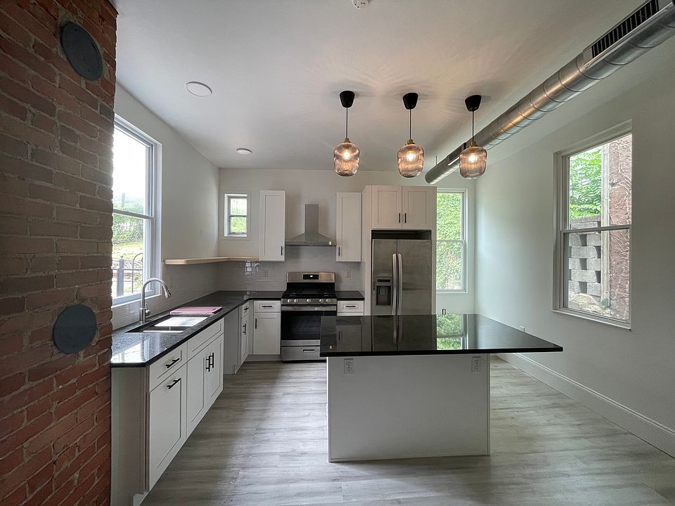 Kitchen with windows on three sides