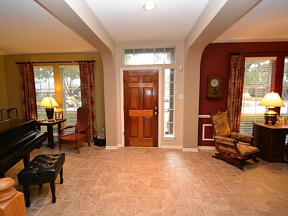 Entry offering tile flooring and access to a half bath.
