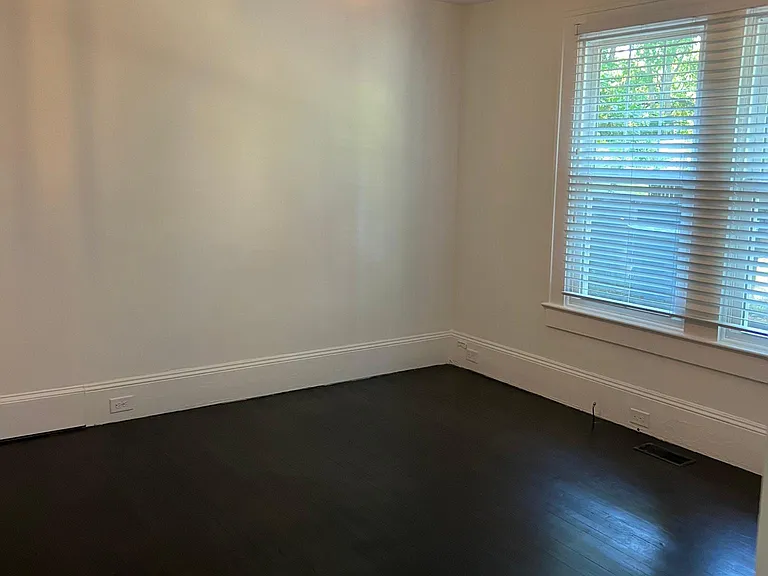 First look into the larger bedroom to the right.