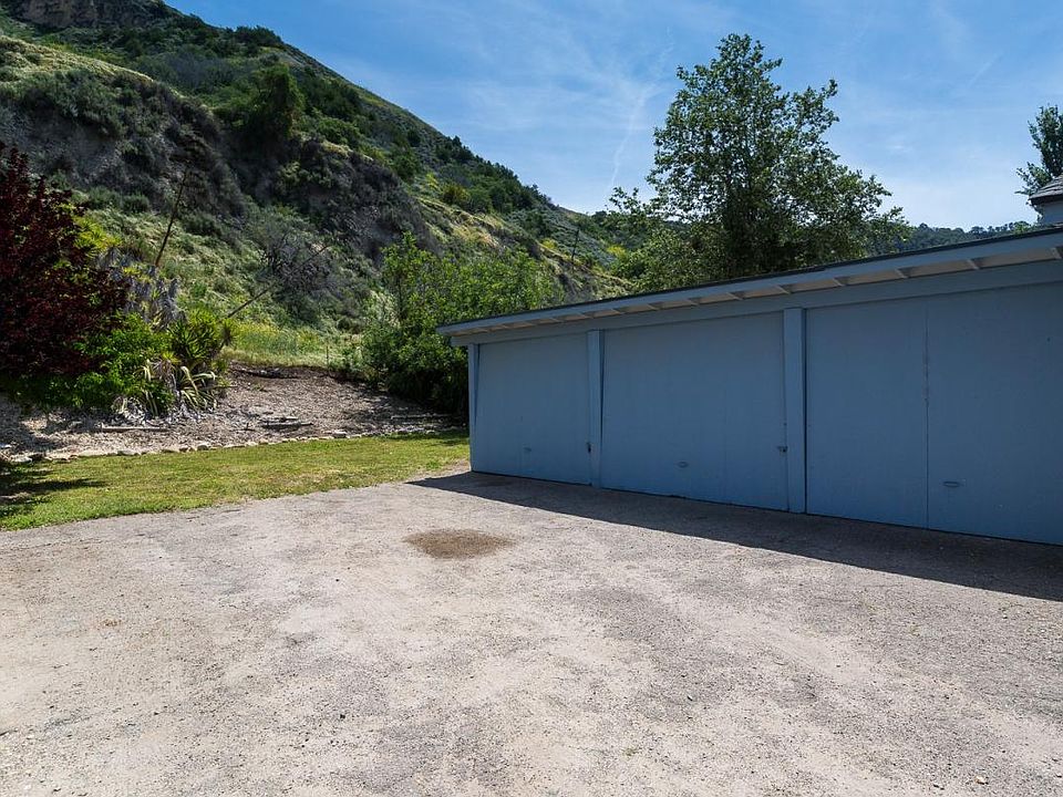 Garages and another view of backyard.