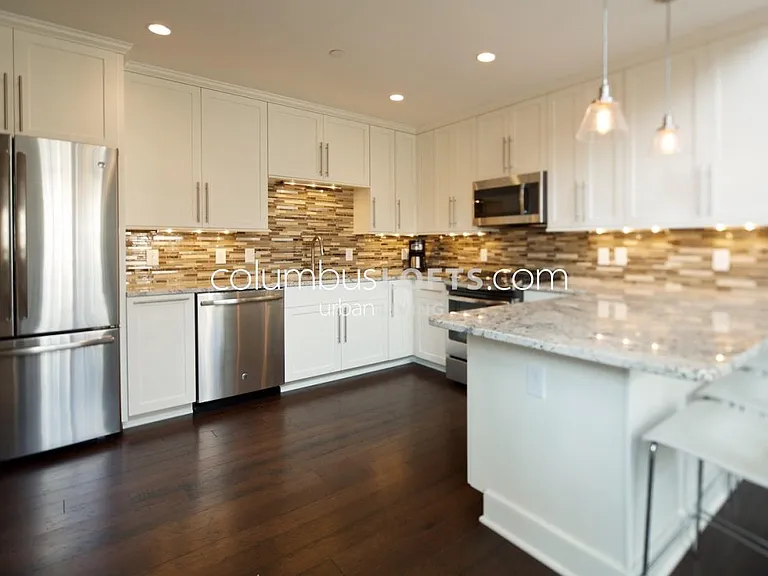 kitchen including peninsula breakfast bar