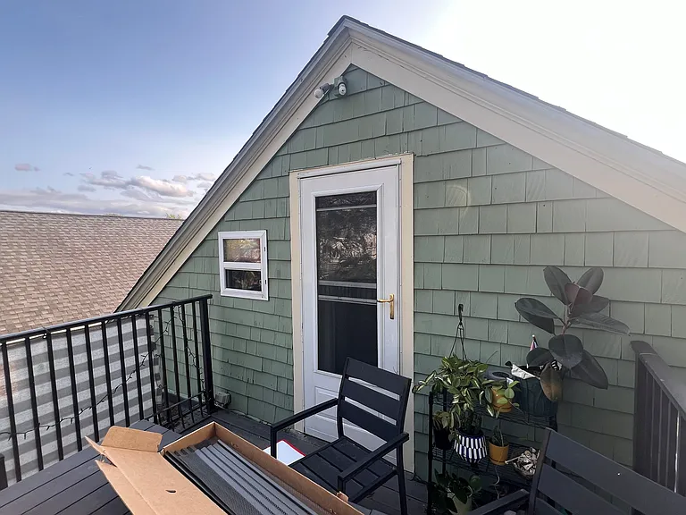 View from exterior deck looking at the house / exterior door.