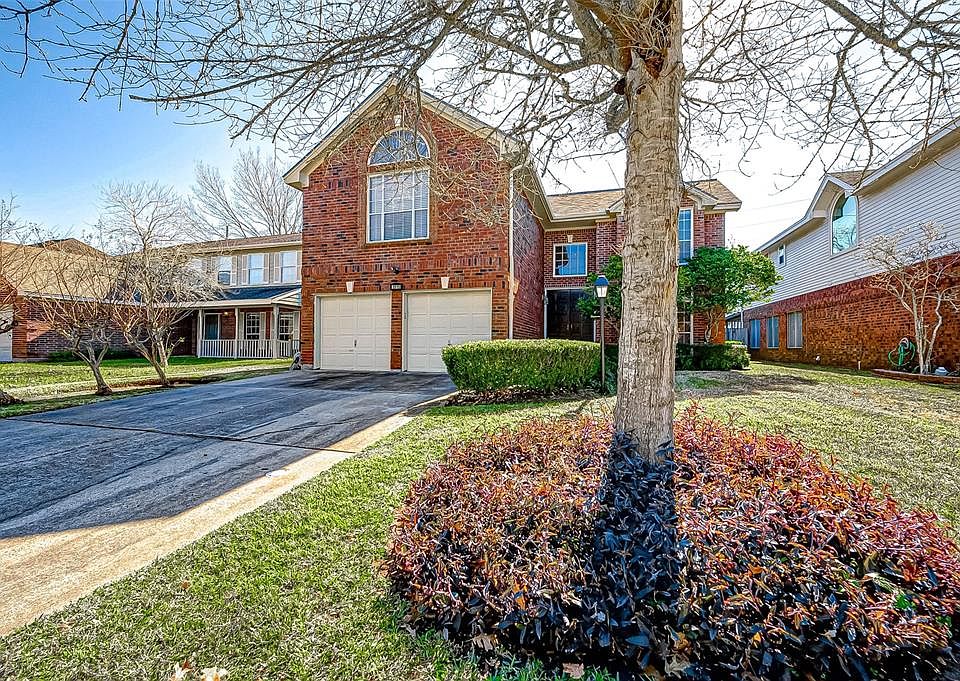 Gorgeous 2-story red brick home with 2-car garage and double wide driveway offering plenty of space for additional parking for family and friends. Mature trees and shrubs add to the handsome curb appeal.