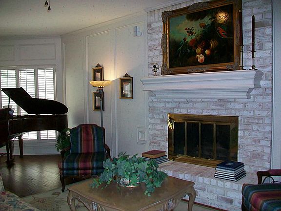 A COMFY COZY FIREPLACE FILLS THE ROOM WITH WARMTH ON CHILLY NIGHTS