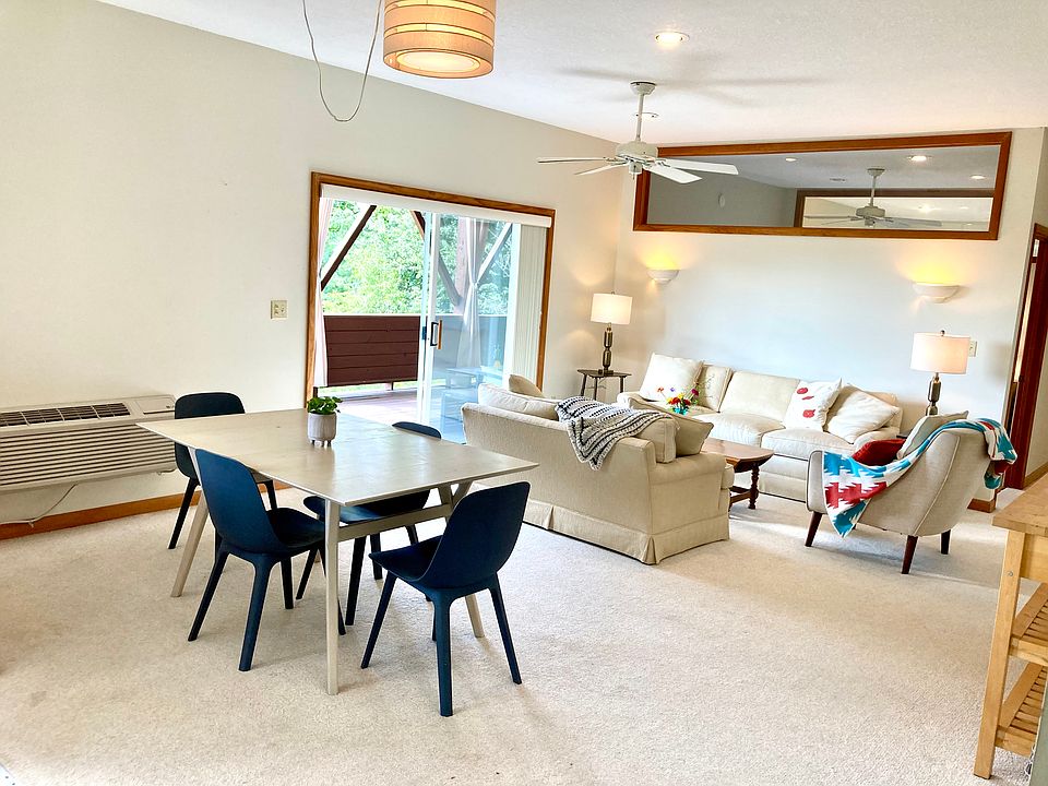 Dining and living room areas. (Furniture for staging purposes only)