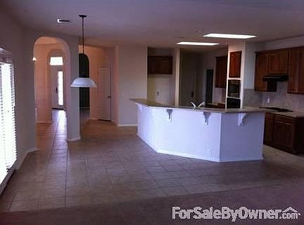 Formal Living
						:
						This is a view right inside the entry arches for the Formal Living Room.