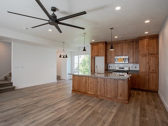 Main living area with 72" ceiling fan and 9 foot ceilings.