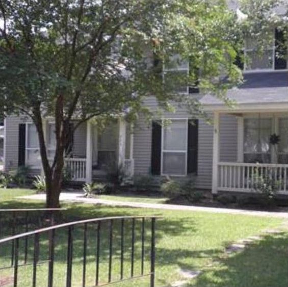 A cozy place... front porch w/ wrought iron swing 