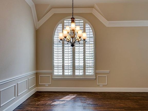 Triple crown molding with 6 in. base, custom plantation shutters