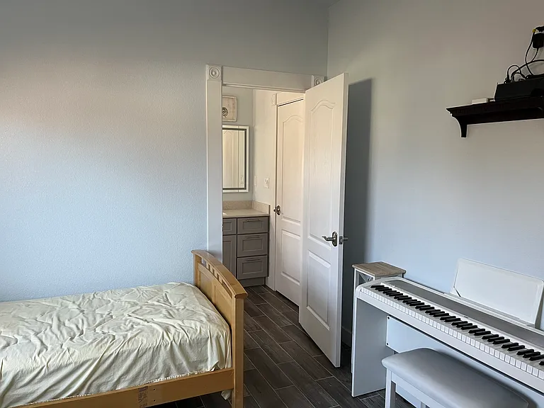 You have to walk across either bedroom to reach the full bathroom.