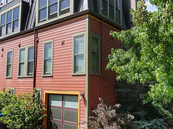 Small car garage accessed from alley. Will accomodate cars up to the size of a small Prius.
