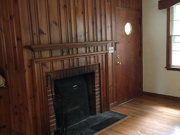 Pine paneling with working fireplace