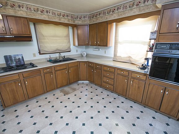 Continuing into the Kitchen (12x17), you will be shocked at the size. A large eat-in style kitchen offers ample counter space and appliances that are included in the sale. 