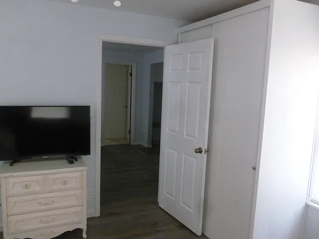 Front office/bed room with door to bathroom visible in back