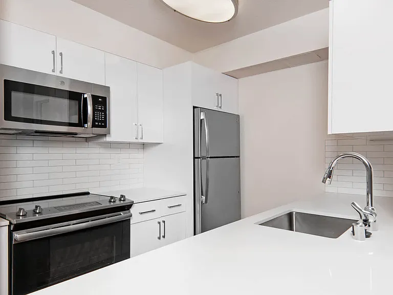 Renovated Kitchen with Stainless Steel Appliances and Granite Countertops