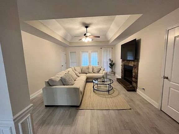 Dining area opens up to the living room. Laundry area through the right door. Master bedroom through the back left door.