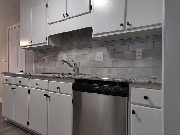 Freshly painted cabinets, backsplash to modernize kitchen