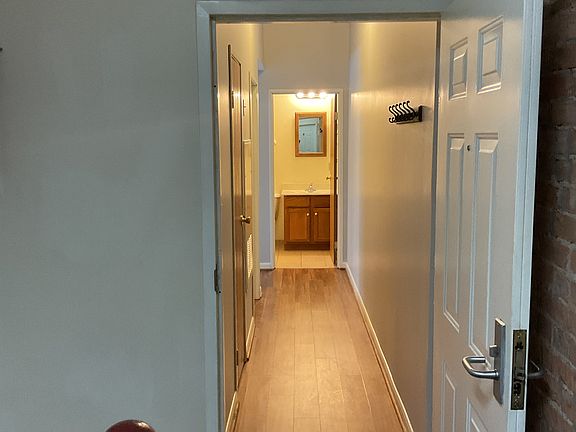 Hall entrance with coat closet.