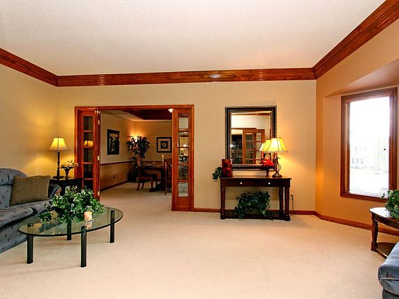 Spacious living room with crown mouldings!