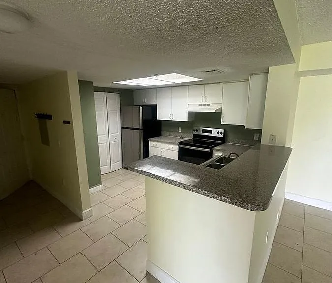 5005 Wiles Rd #102 — Photo 3