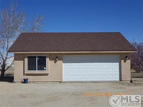 Detached garage with 3/4 bath and pull thru.