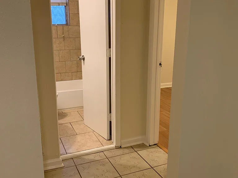 Dining area to rooms and bathroom.
