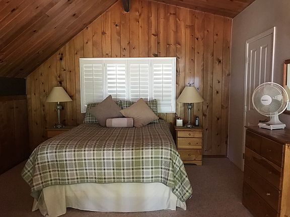 loft looking at trees & lake