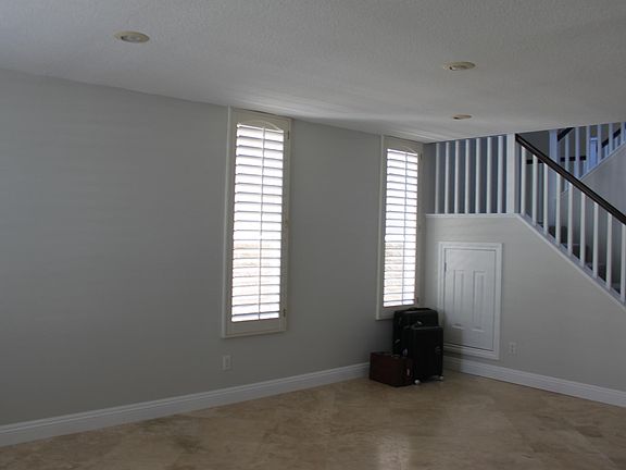 Living room area with understairs storage