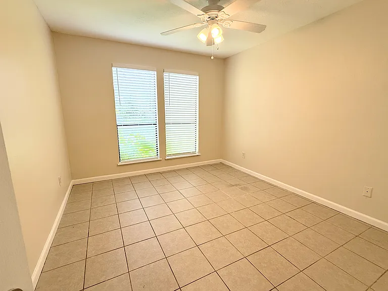 Versatile fourth bedroom perfect for guests, children, or a dedicated workspace, offering a spacious layout and abundant natural light.