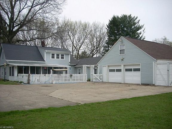 Just outside the sun room is a nice area for cookouts or just relaxing and enjoying the sun.  Above the garage are 2 good size rooms your choice of use.