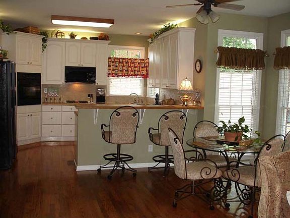Breakfast area and gourmet kitchen with a gas cook top, electric oven, pantry.