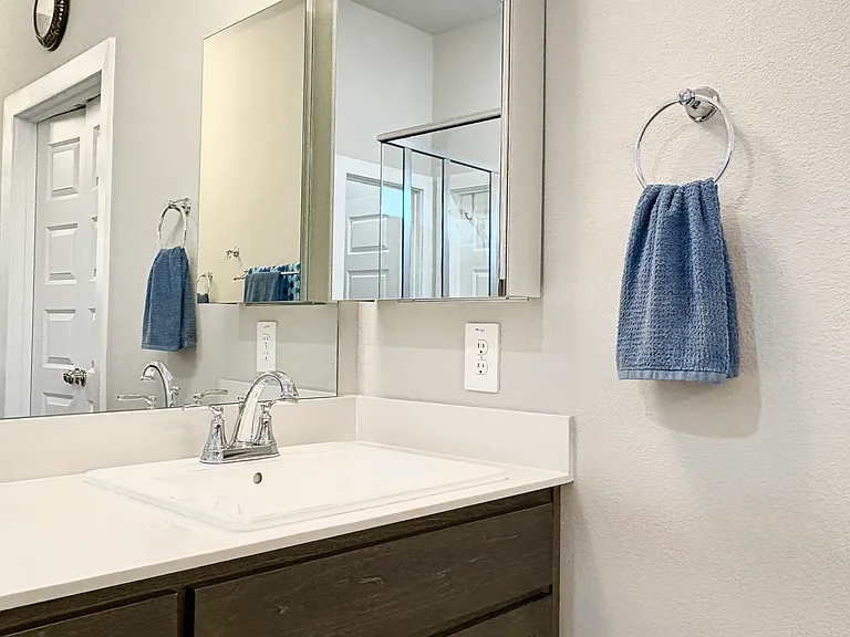 3 shelf Mirrored Medicine cabinet for extra storage.