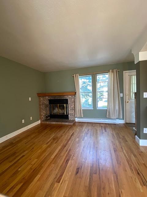 Living Room with large trees out your front window.