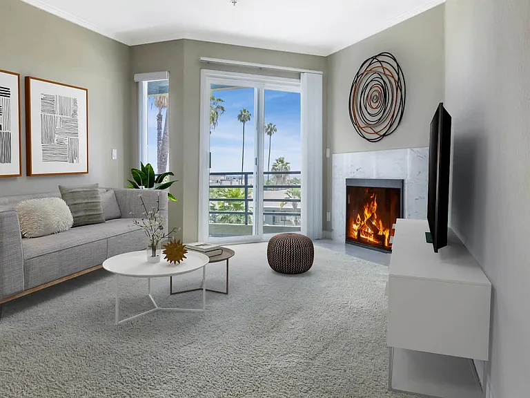 Carpeted Living Room with Balcony and Fireplace