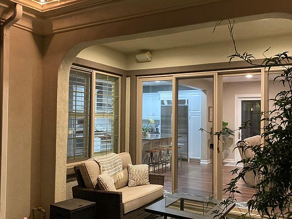 Covered porch with firepit table and outdoor furniture included!