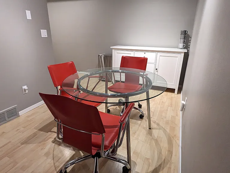 Perfect dining area with a glass table and 3 chairs.