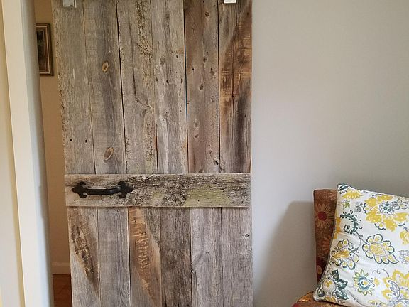 Barn door entrance to master suite and laundry room