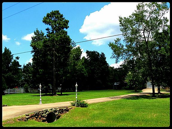 Entrance with stone and lamp accents welcomes you home.