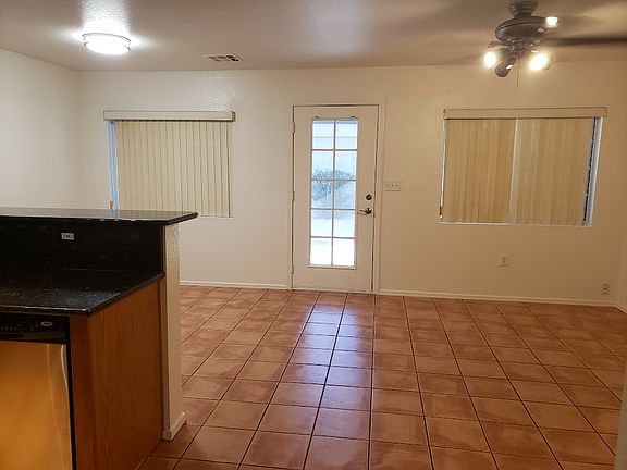 Dinning room (left side), back door, living room (right side)