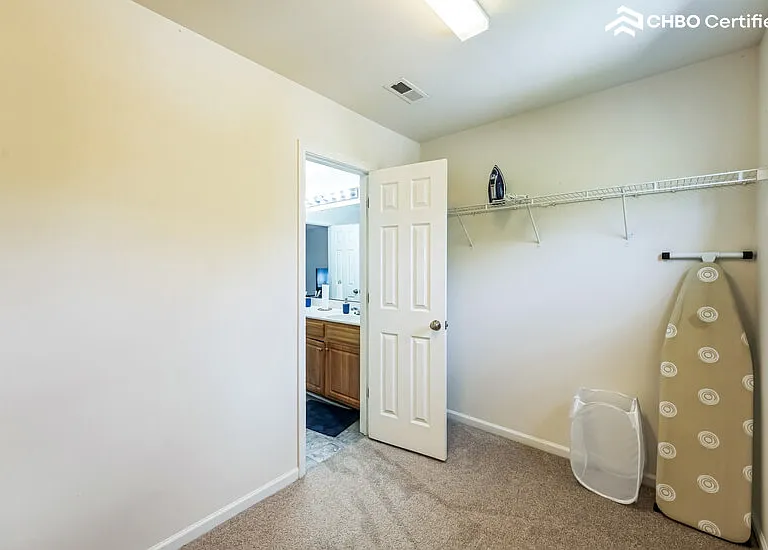 Primary bedroom large walk in closet .