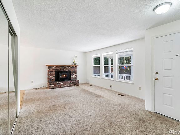 Entry and living room. Wood stove insert