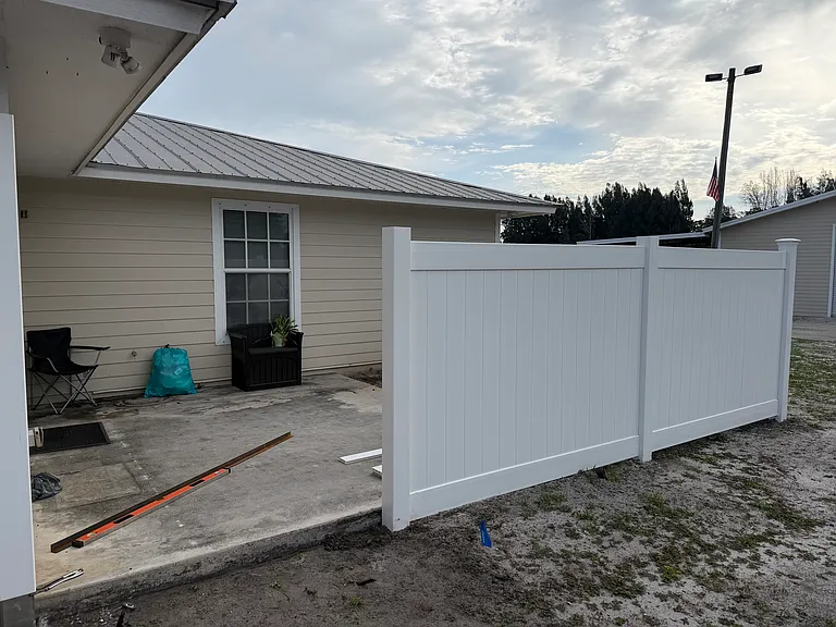 Private outdoor patio with 6ft PVC Privacy fencing all the way around with gate.